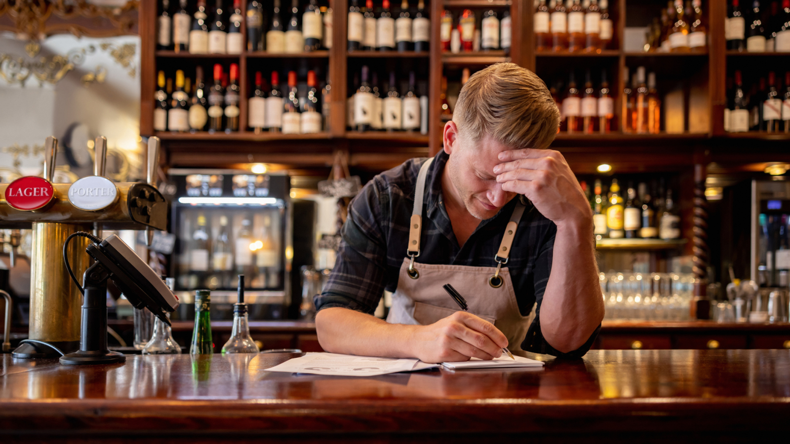 Business manager working at a pub doing the accountancy