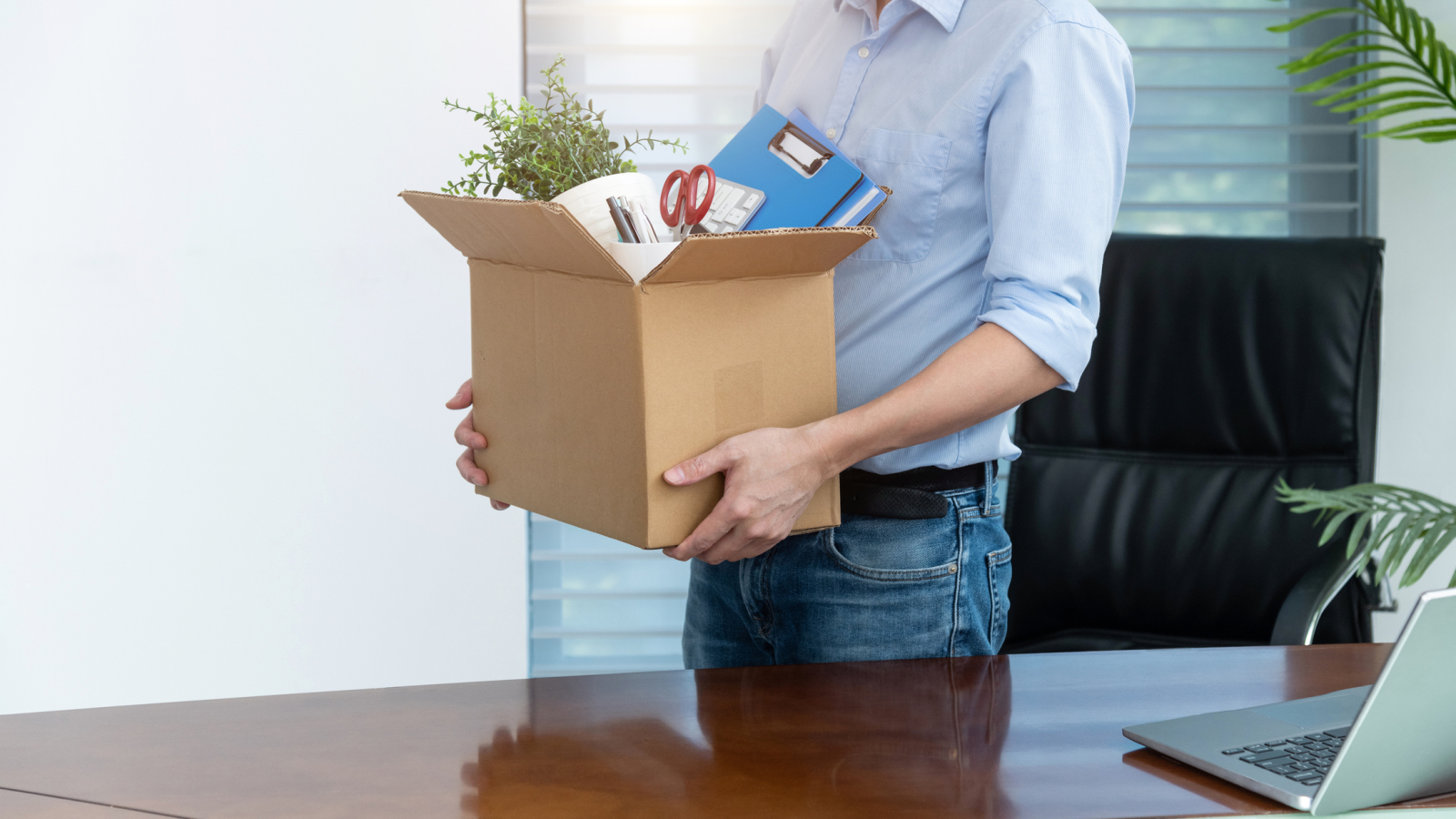 Unemployed man packing his belongings