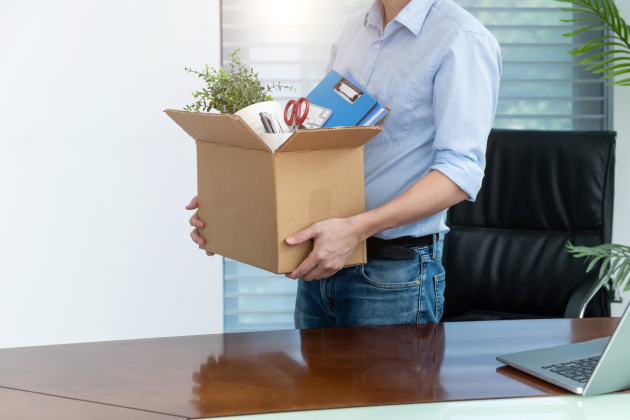 Unemployed man packing his belongings