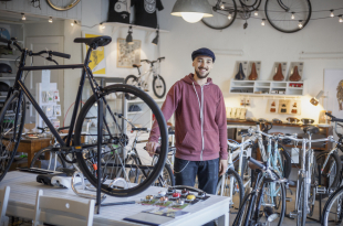 young man in bicycle shop