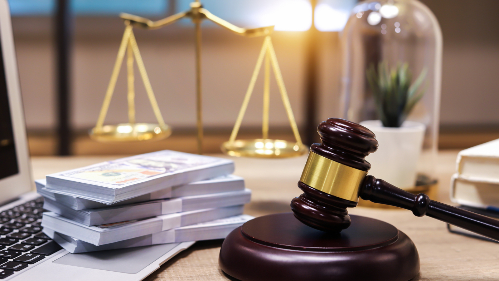 US paper currency on Laptop and gavel,Money with a hammer
