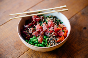 Close-up of poke bowl with tuna, edamame beans and vegetables