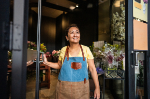 Mature saleswoman contemplating at a garden center