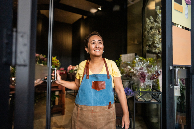 Mature saleswoman contemplating at a garden center