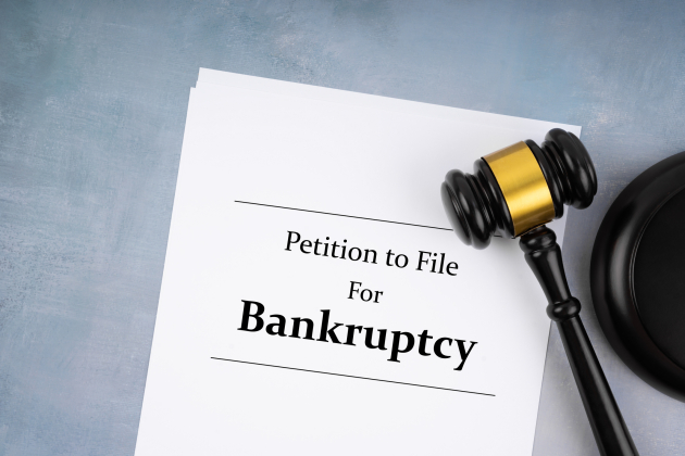 Bankruptcy document with wooden gavel, Buseniss concept. Flat lay.