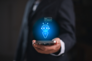 Businessman holding smartphone with virtual AI assistant chatbot hologram, smart technology for digital communication, innovation and artificial intelligence solutions in modern business. AI