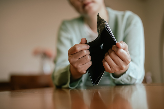 Asian Young Woman Holding Empty Wallet in Financial Crisis