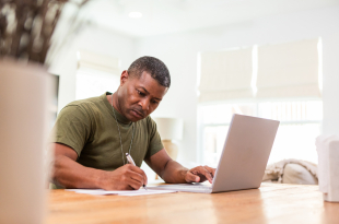 Serious mature soldier continues education online