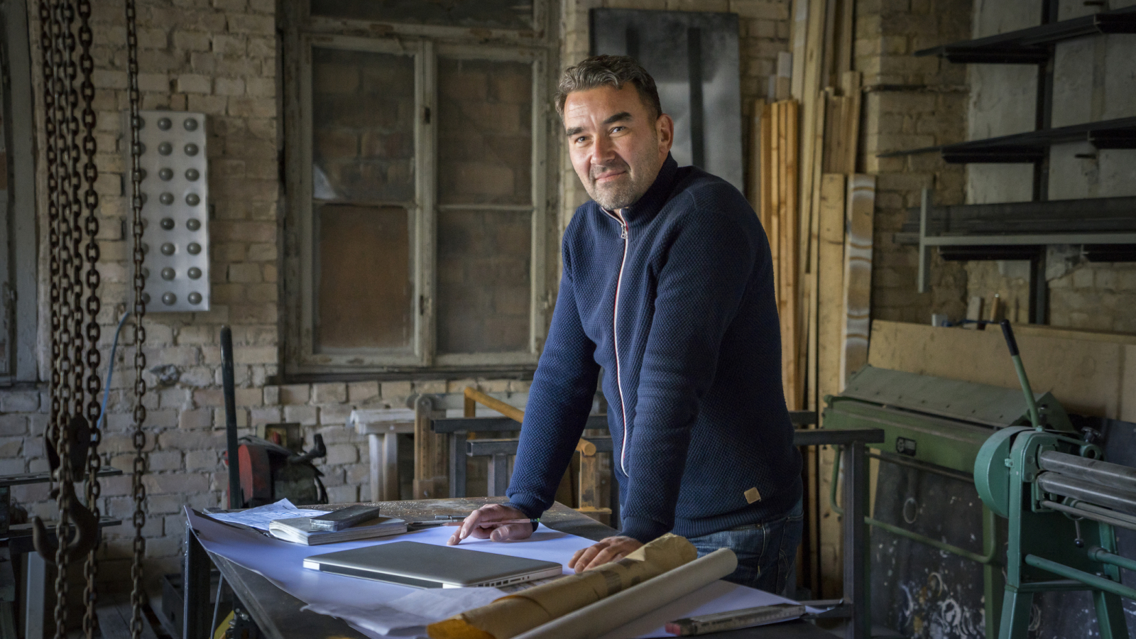 Portrait of confident craftsman in workshop