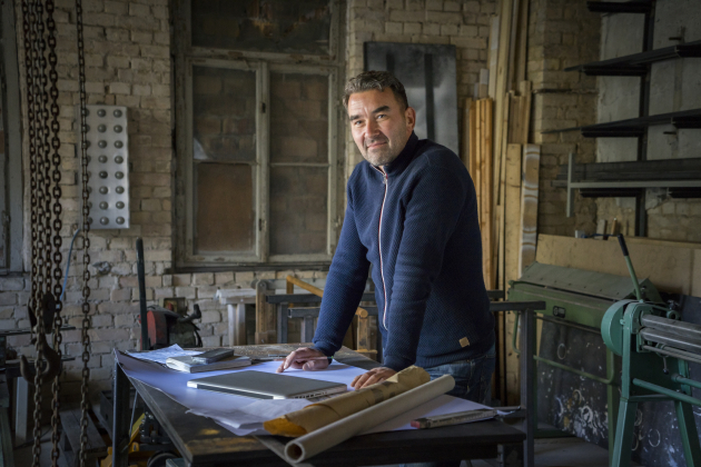 Portrait of confident craftsman in workshop