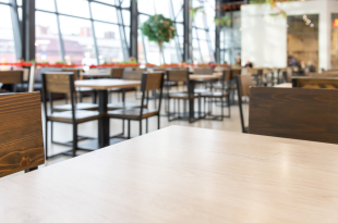 Empty wooden table in food court