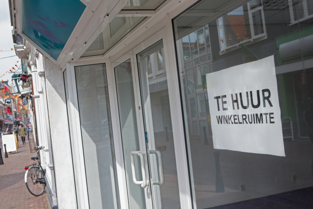 Business for rent sign. Vacancy. Recession. Shopping street