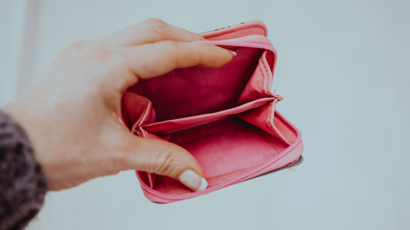 woman hand holding empty wallet