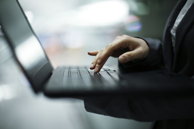 business woman using notebook PC,hands close-up