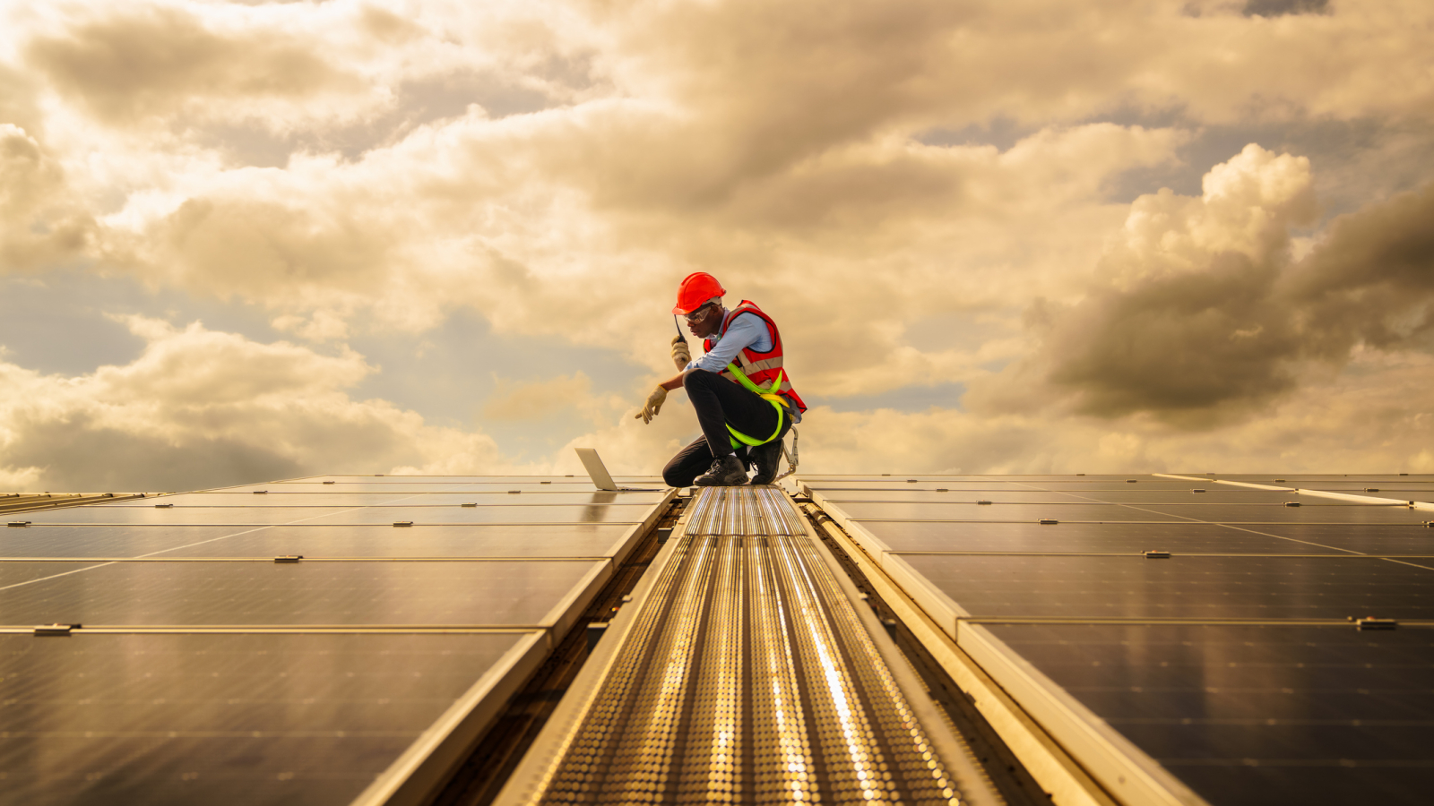 African american engineering are about to checking solar panels. Electrical and instrument technician use laptop to maintenance electric solution